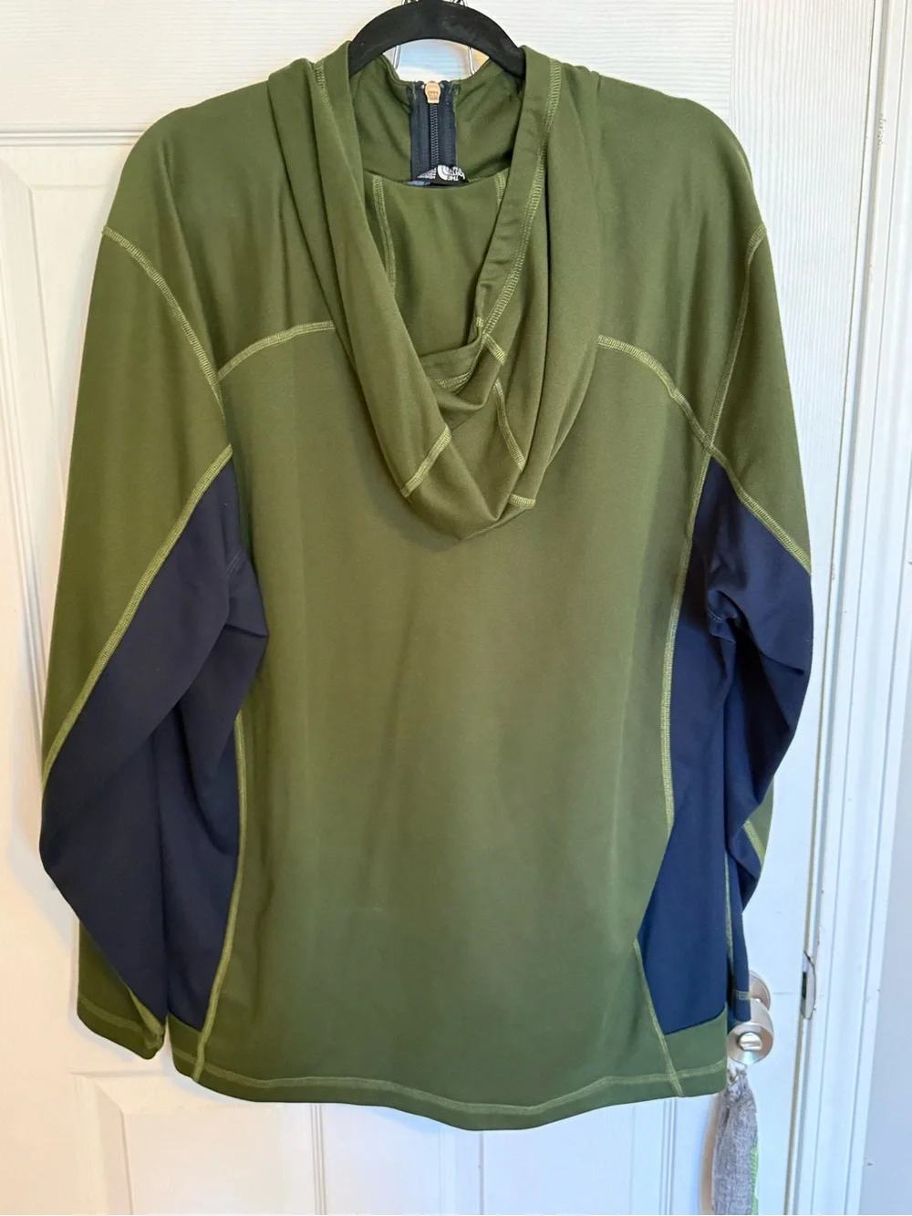 North face zip up. Green and blue. Multiple pockets.